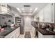 Well-lit kitchen with modern appliances, white cabinets, dark counters, and a decorative backsplash at 3109 W Loma Ln, Phoenix, AZ 85051