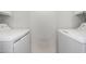 Laundry room featuring side by side washing machine and dryer with white cabinets at 3109 W Loma Ln, Phoenix, AZ 85051