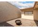 Private backyard patio with a fire pit and a desert landscaped block wall at 3109 W Loma Ln, Phoenix, AZ 85051