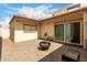 Private backyard patio with pavers, fire pit, and sliding glass doors at 3109 W Loma Ln, Phoenix, AZ 85051