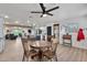 Open dining room with wood floors, a wood table, and views of the kitchen and living spaces at 3320 E Claire Dr, Phoenix, AZ 85032