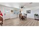 Cozy dining area featuring a window for natural light and a ceiling fan for comfort at 3320 E Claire Dr, Phoenix, AZ 85032
