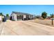 A well-maintained home featuring a concrete driveway and modern exterior paint scheme at 3320 E Claire Dr, Phoenix, AZ 85032