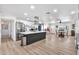 Open-concept kitchen with a center island, stainless steel appliances, and a connected dining area at 3320 E Claire Dr, Phoenix, AZ 85032