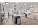 Spacious kitchen with an island, stainless steel appliances, and white cabinets with sleek hardware at 3320 E Claire Dr, Phoenix, AZ 85032
