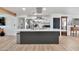 Bright kitchen with an island, stainless steel appliances, and open access to the living area at 3320 E Claire Dr, Phoenix, AZ 85032