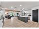 An open-concept living and kitchen space, showcasing modern design and ample natural light at 3320 E Claire Dr, Phoenix, AZ 85032
