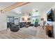 The living room features light hardwood floors and lots of space for gathering and entertaining at 3320 E Claire Dr, Phoenix, AZ 85032