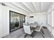 Covered patio features a dining table and chairs with access to the interior through sliding doors at 3320 E Claire Dr, Phoenix, AZ 85032