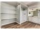 Bathroom features a walk-in shower, wood floors, open shelving, and a vanity with granite countertops at 3832 N Gallatin --, Mesa, AZ 85215