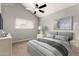 Relaxing bedroom with a plush bed, neutral tones, and a ceiling fan for added comfort at 3832 N Gallatin --, Mesa, AZ 85215