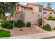 Exterior view of a home featuring a tile roof, unique architectural details, and desert-friendly landscaping at 3832 N Gallatin --, Mesa, AZ 85215