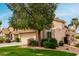 Exterior shot of a house with a beautiful green lawn, mature tree, and inviting curb appeal at 3832 N Gallatin --, Mesa, AZ 85215