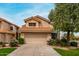 Charming home with a tile roof, two-car garage, and colorful bushes in a well-maintained yard at 3832 N Gallatin --, Mesa, AZ 85215