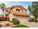 Front exterior showing beautiful landscaping, tile roof, and spacious two car garage of this lovely home at 3832 N Gallatin --, Mesa, AZ 85215