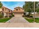 Charming home featuring a tile roof, two-car garage, and beautiful flowering bushes in the front yard at 3832 N Gallatin --, Mesa, AZ 85215