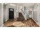 Inviting foyer with hardwood floors, staircase, and a view into the upstairs bathroom at 3832 N Gallatin --, Mesa, AZ 85215