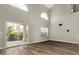Bright living room featuring hardwood floors, high ceilings, lots of natural light, and a sliding glass door at 3832 N Gallatin --, Mesa, AZ 85215