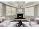 Cozy living room with a fireplace and large windows providing ample natural light at 3832 N Gallatin --, Mesa, AZ 85215