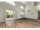 Bright living room featuring hardwood floors, high ceilings, lots of natural light, and a sliding glass door at 3832 N Gallatin --, Mesa, AZ 85215