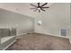 Spacious loft area features carpet floors, recessed lighting, and large arched window with a view outside at 3832 N Gallatin --, Mesa, AZ 85215