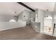 View of the loft area with carpet floors, arched windows, and a view of the bathroom at 3832 N Gallatin --, Mesa, AZ 85215