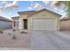 Charming single-story home with a well-maintained front yard, tile roof, and attached two-car garage at 40054 W Tamara Ln, Maricopa, AZ 85138