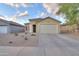 Charming one-story home featuring a well-maintained front yard with desert landscaping and a two car garage at 40054 W Tamara Ln, Maricopa, AZ 85138
