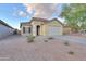 Inviting single-level home featuring a well-kept front yard and a convenient two-car garage at 40054 W Tamara Ln, Maricopa, AZ 85138