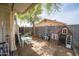 Backyard featuring a playhouse and mature shade tree providing a comfortable place to relax and play at 402 W Mohawk Ln, Phoenix, AZ 85027