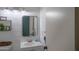 Updated half bathroom showing modern mirror and sink vanity at 402 W Mohawk Ln, Phoenix, AZ 85027
