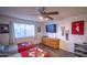 Well lit bedroom with two twin beds, wooden dresser, and ceiling fan at 402 W Mohawk Ln, Phoenix, AZ 85027