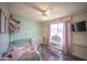 Light and bright bedroom with view to street and built in shelves at 402 W Mohawk Ln, Phoenix, AZ 85027