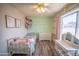 Light and bright bedroom with view to street and built in shelves at 402 W Mohawk Ln, Phoenix, AZ 85027
