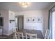Modern dining room featuring a sleek table set with stylish decor, and ample natural light at 402 W Mohawk Ln, Phoenix, AZ 85027