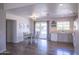 Inviting dining area featuring a sleek table set next to a sliding glass door and stylish decor at 402 W Mohawk Ln, Phoenix, AZ 85027