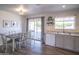 Inviting dining area featuring a sleek table set next to a sliding glass door and stylish decor at 402 W Mohawk Ln, Phoenix, AZ 85027