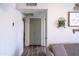 Inviting hallway with wood-like floors, leading to a bedroom or closet, with neutral decor at 402 W Mohawk Ln, Phoenix, AZ 85027