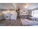 Spacious living room featuring a plush sectional sofa adjacent to the bright kitchen at 402 W Mohawk Ln, Phoenix, AZ 85027