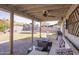 Outdoor patio with a seating area, a ceiling fan, and views of the spacious backyard at 402 W Mohawk Ln, Phoenix, AZ 85027