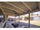 Covered patio with ceiling fan and outdoor seating area, perfect for relaxing and entertaining guests at 402 W Mohawk Ln, Phoenix, AZ 85027