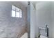 Bathroom featuring tiled shower, toilet, and grab bar at 4023 W Joan De Arc Ave, Phoenix, AZ 85029