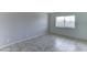 Bright bedroom with tile flooring and large window at 4023 W Joan De Arc Ave, Phoenix, AZ 85029