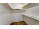 Walk-in closet featuring wood-look floors and shelving at 4023 W Joan De Arc Ave, Phoenix, AZ 85029
