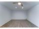 Living room featuring modern ceiling fan, recessed lights, and wood-look floors at 4023 W Joan De Arc Ave, Phoenix, AZ 85029