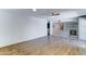 Spacious living room featuring wood floors and an open floor plan flowing into the kitchen at 4023 W Joan De Arc Ave, Phoenix, AZ 85029