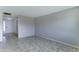 Bright living room features neutral paint, tiled floor, and ample space for comfortable living at 4023 W Joan De Arc Ave, Phoenix, AZ 85029