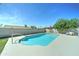 Backyard view of sparkling pool, enclosed by block fence for privacy at 4023 W Joan De Arc Ave, Phoenix, AZ 85029