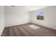 Bright bedroom with plush carpet, a window offering natural light, and ample space at 4051 N Ghost Hollow Way, Casa Grande, AZ 85122