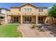 Spacious back exterior with covered patio, stucco finish, and well-manicured lawn offering serene outdoor living at 4125 W Lydia Ln, Phoenix, AZ 85041